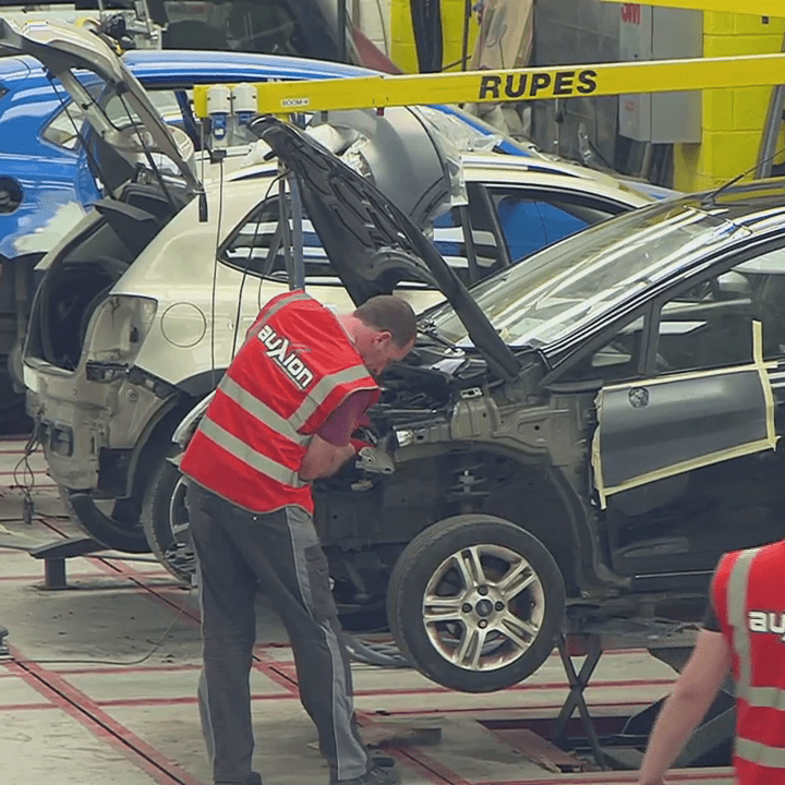 Engineers assessing a vehicle